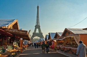 Paris, France. Christmas shopping in a market of chalets below the Eiffel Tower,. Image shot 2011. Exact date unknown.